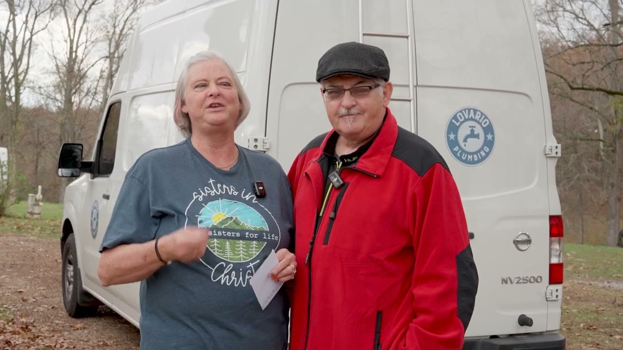 Two LoVario customers standing by the LoVario Plumbing van